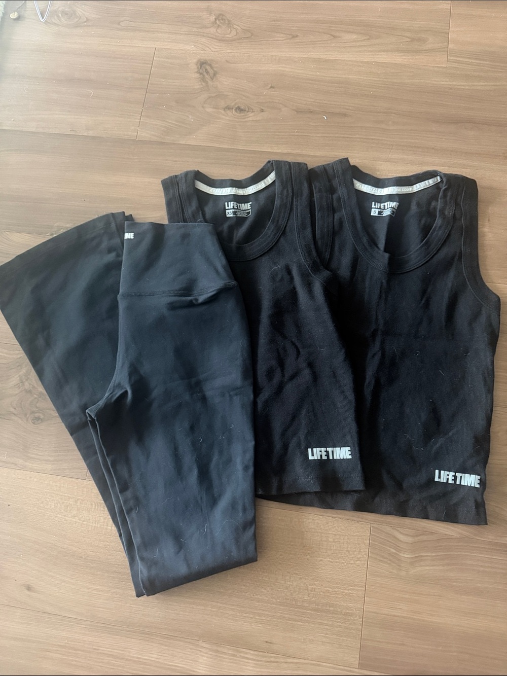 Woman’s Black Active Tank Tops & Leggings Set from Life Time .